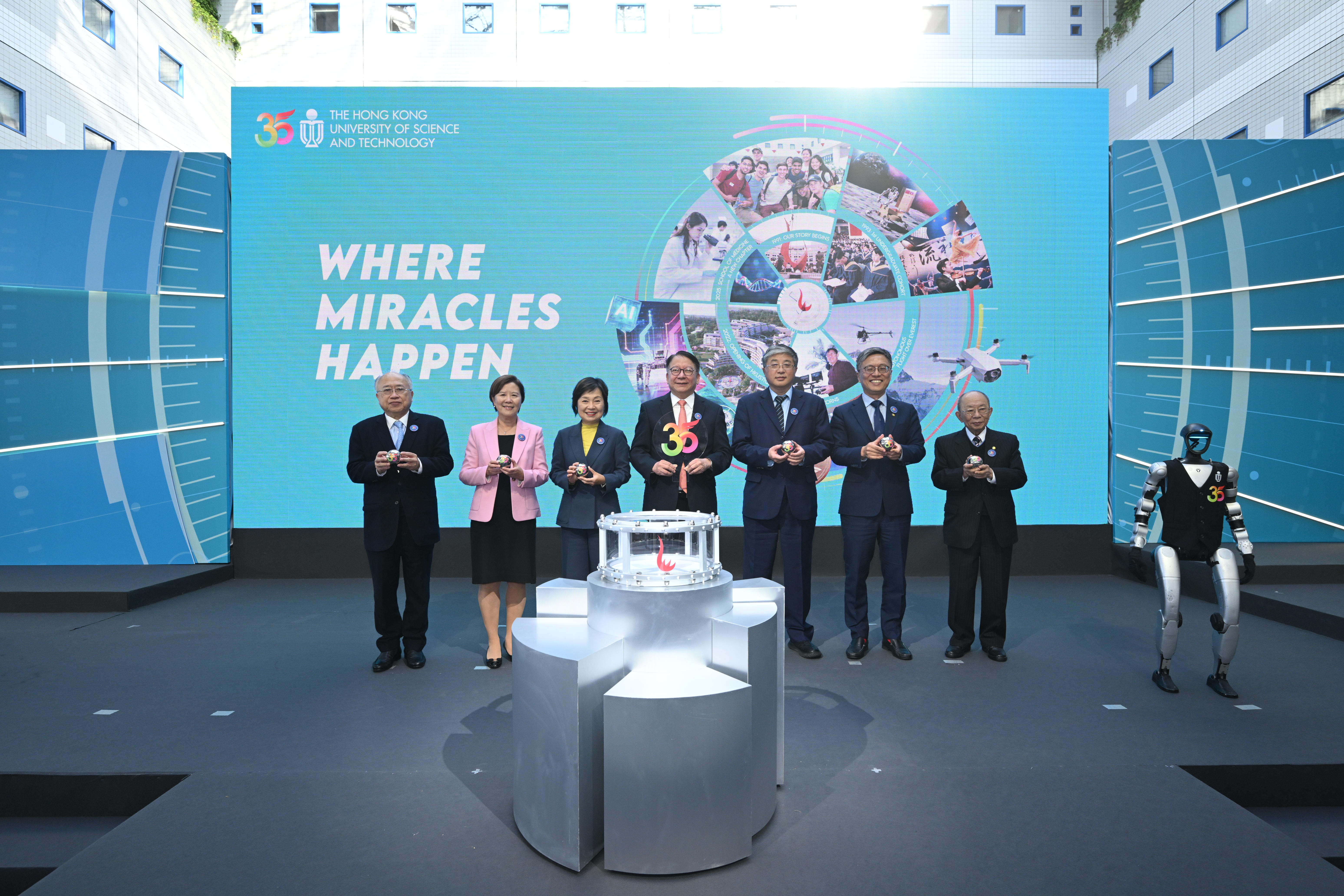 The Chief Secretary for Administration of the HKSAR Government Mr. CHAN Kwok-ki (middle), Deputy Director of LOCPG Mr. LUO Yonggang (third right), Secretary for Education of the HKSAR Government Dr. Christine CHOI Yuk-lin (third left) and members of the HKUST leadership team, including Pro-Chancellor Dr. John CHAN Cho-Chak (first right), Council Chairman Prof. Harry SHUM (second right), Court Chairman Dr. the Honorable Andrew LIAO Cheung-Sing (first left), and President Prof. Nancy IP (second left) inaugurate a series of commemorative initiatives for the HKUST 35th anniversary.
